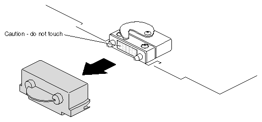 Figure 5-31 Removing the Cap From the XIO Compression Connector